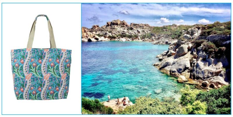 bolso estampado de flores en tonos azujes junto a paisaje rocoso de una playa